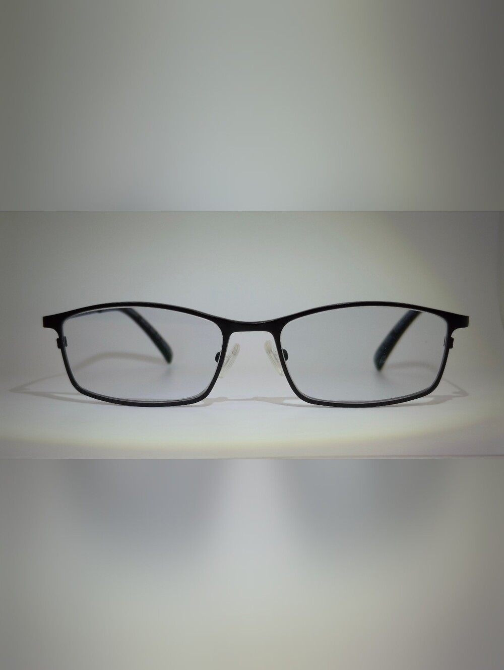Present. Black Rectangular Metal Frame.